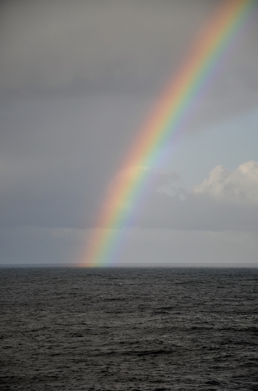 Rainbow over the pacific ocean