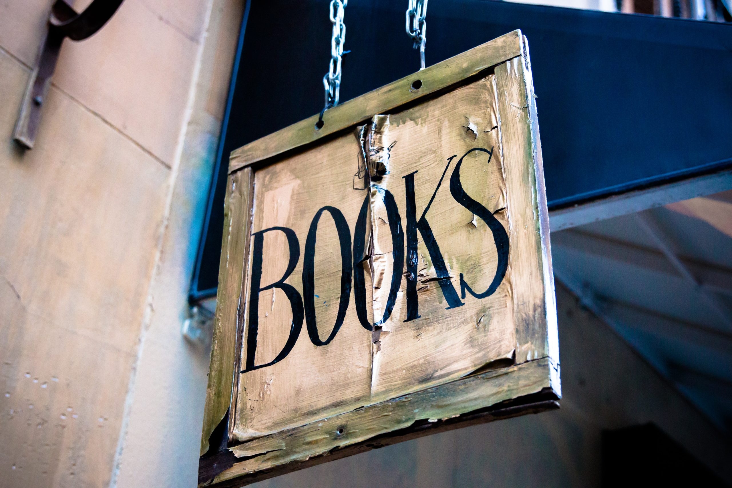 distressed hanging book sign